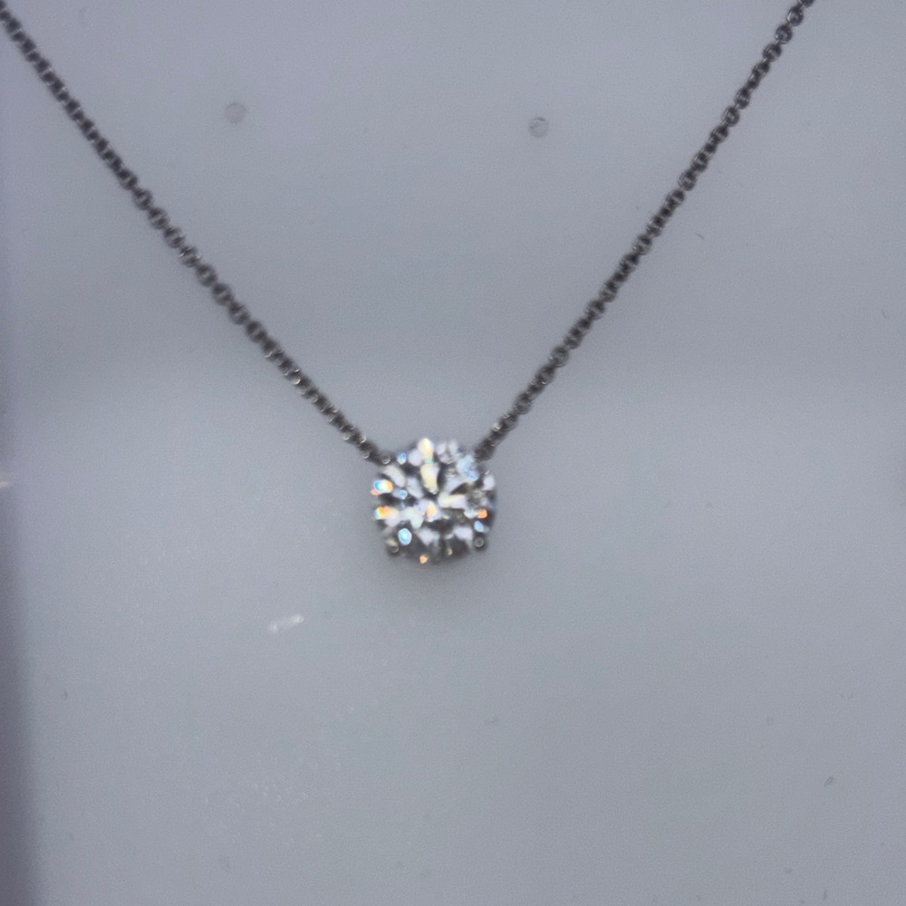 14k white solid gold pendent. With 3 crt lab grown diamond. Chain is 16”.